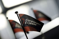 Corporate Express lorry on road with man at back