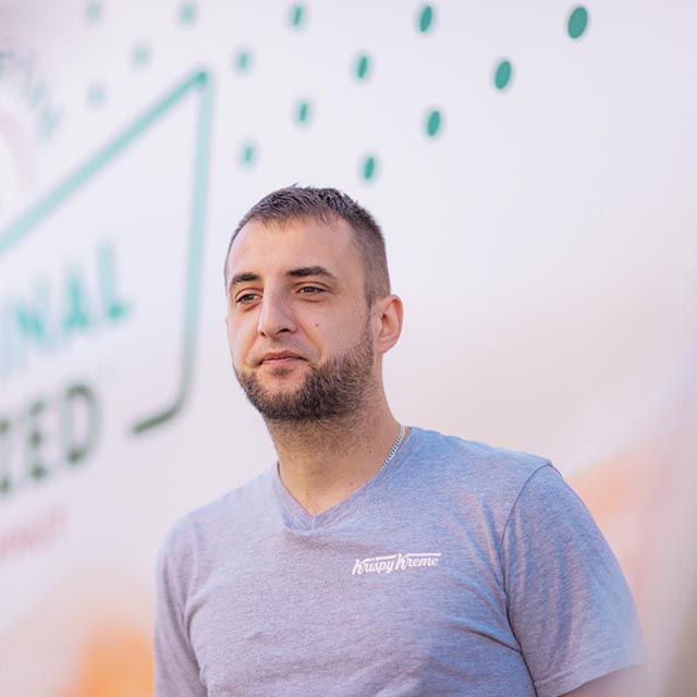 Young man standing beside a lorry