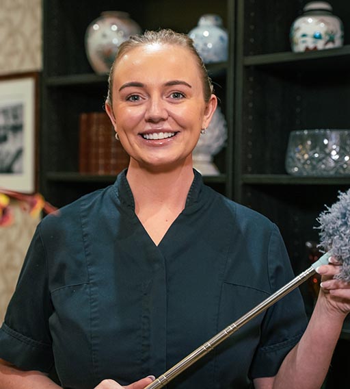 woman with feather duster