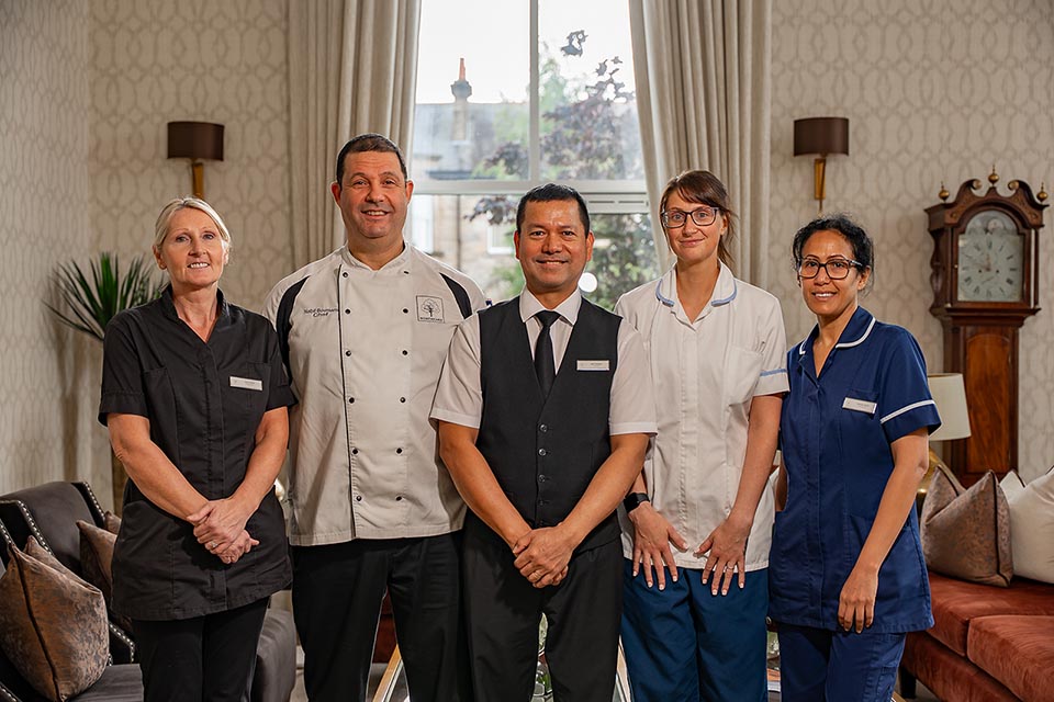 Team members standing in a row