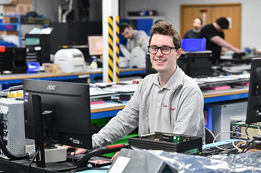 happy person working at a computer