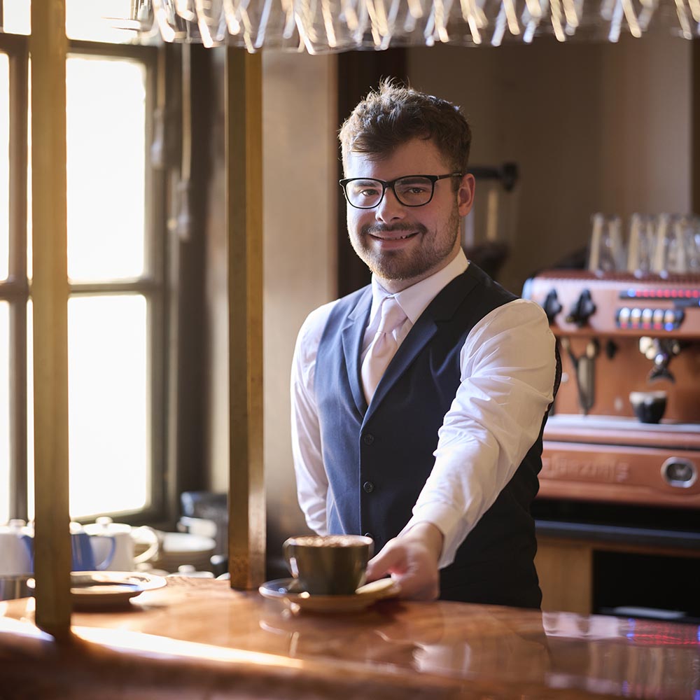 barista serving coffee