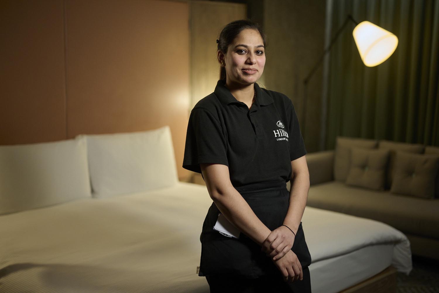 housekeeper in a bedroom