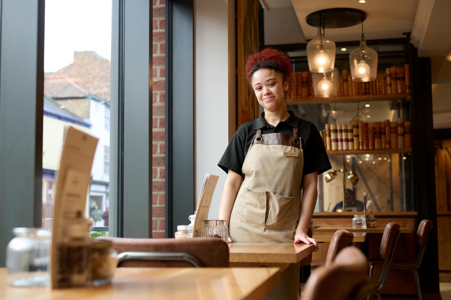 young woman stands in the restaurant