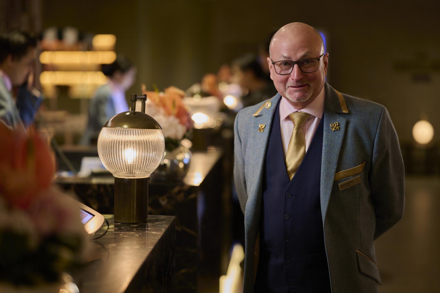 concierge stands near reception desk